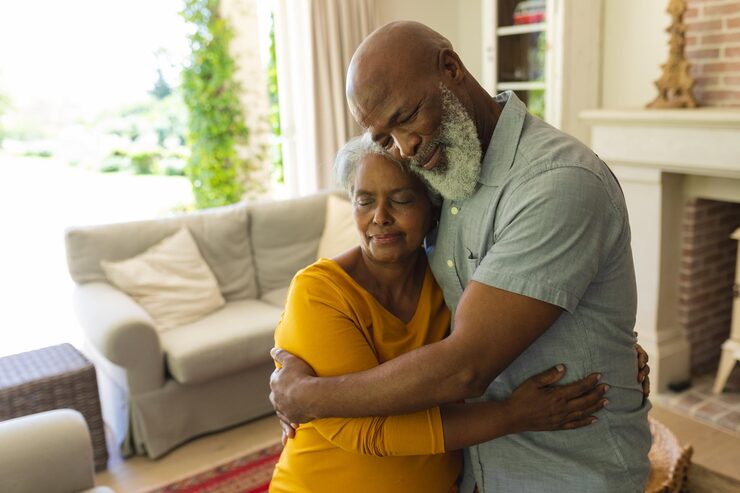 Petroleum Dynamics Slide 01 senior african american couple embracing with eyes closed living room retreat retirement happy senior lifestyle concept 13339 321480
